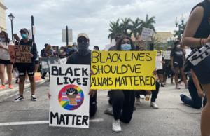 Protesters take a knee during a protest against police brutality on June 6, 2020 in Miramar. (Jordon Coll/SFMN)
